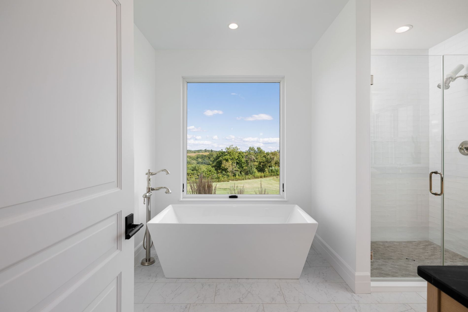 Primary Bath Soaking Tub with a Window to the World